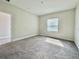 Bedroom with carpet, window, and neutral paint at 144 Angelas Ave, Haines City, FL 33844