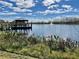 A tranquil lake with a charming gazebo provides a serene escape and scenic views for community members at 144 Angelas Ave, Haines City, FL 33844