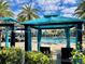 A luxurious pool area featuring private cabanas and comfortable lounge chairs, perfect for relaxation and leisure at 144 Angelas Ave, Haines City, FL 33844