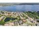 Aerial view of community with lake, pond, and homes with private docks and manicured lawns at 1448 Conway Isle Cir, Belle Isle, FL 32809
