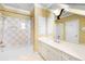 Bathroom featuring white vanity, mirror, and shower/tub combo with tiled walls at 1448 Conway Isle Cir, Belle Isle, FL 32809