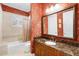 Bathroom with wallpaper, and a marble vanity top at 1448 Conway Isle Cir, Belle Isle, FL 32809