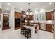 Spacious kitchen with granite countertops, stainless steel appliances, and a central island with barstool seating at 1448 Conway Isle Cir, Belle Isle, FL 32809