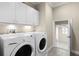 Laundry room featuring cabinetry and washer and dryer units at 1448 Conway Isle Cir, Belle Isle, FL 32809