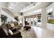 Bright living room with fireplace, coffered ceilings, french doors to the backyard, and staircase at 1448 Conway Isle Cir, Belle Isle, FL 32809