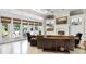 Spacious living room featuring fireplace, backyard views, coffered ceilings and ample seating at 1448 Conway Isle Cir, Belle Isle, FL 32809