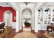 Open living space with hardwood floors, decorative columns, archways, and view to the outdoors at 1448 Conway Isle Cir, Belle Isle, FL 32809