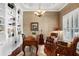 Home office with hardwood floors, built-in shelving, and coffered ceilings at 1448 Conway Isle Cir, Belle Isle, FL 32809