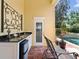 Outdoor kitchen adjacent to the pool at 1448 Conway Isle Cir, Belle Isle, FL 32809