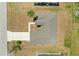 A nice aerial view of the home's roof, driveway, and landscaping at 15 Sawfish Ln, Kissimmee, FL 34759