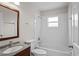 Bright bathroom featuring tile shower, modern vanity, and updated fixtures at 15 Sawfish Ln, Kissimmee, FL 34759