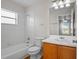 The bathroom features a white vanity and tub/shower combo at 15 Sawfish Ln, Kissimmee, FL 34759