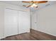A bedroom with a ceiling fan, closet, and fresh paint is move-in ready at 15 Sawfish Ln, Kissimmee, FL 34759