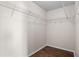 Walk-in closet with shelving and hardwood floors at 15 Sawfish Ln, Kissimmee, FL 34759