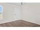Bright empty room with laminate flooring, freshly painted walls, and a window with blinds at 15 Sawfish Ln, Kissimmee, FL 34759