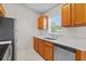 The kitchen has stainless steel appliances, wood cabinets, and a white countertop at 15 Sawfish Ln, Kissimmee, FL 34759