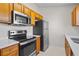 Bright kitchen with stainless steel appliances and white countertops at 15 Sawfish Ln, Kissimmee, FL 34759