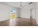 Bright living room with vaulted ceilings and sliding glass doors to backyard at 15 Sawfish Ln, Kissimmee, FL 34759