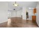 Open floor plan with updated floors connects the living room and kitchen at 15 Sawfish Ln, Kissimmee, FL 34759