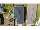 An aerial view of a house in its neighborhood, showing the roofline and surrounding properties at 16301 Sanctuary Reserve Loop, Clermont, FL 34714