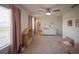 Spacious Bedroom with pink curtains, a dresser, a play area and walk in closet at 16301 Sanctuary Reserve Loop, Clermont, FL 34714