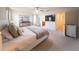 Bedroom with a ceiling fan and an en-suite bathroom and walk-in closet at 16301 Sanctuary Reserve Loop, Clermont, FL 34714