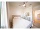 Neutrally decorated bedroom with wood-look floors and a ceiling fan, offering a peaceful retreat at 16301 Sanctuary Reserve Loop, Clermont, FL 34714