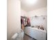 Walk-in closet with shelving, drawers, and hanging clothes, offering ample storage space at 16301 Sanctuary Reserve Loop, Clermont, FL 34714