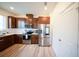 Well-equipped kitchen includes stainless steel appliances, dark wood cabinets, and bright white countertops at 16301 Sanctuary Reserve Loop, Clermont, FL 34714