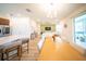 Bright, open-concept living area seamlessly blends the kitchen, dining, and living spaces at 16301 Sanctuary Reserve Loop, Clermont, FL 34714