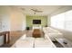 Bright living room with modern furniture and a ceiling fan at 16301 Sanctuary Reserve Loop, Clermont, FL 34714