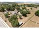 An aerial view of a home and property featuring a treelined border at 16500 Quarter Horse Ct, Montverde, FL 34756
