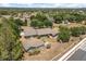 An aerial view of the property with mature trees surrounding the home at 16500 Quarter Horse Ct, Montverde, FL 34756