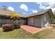 Beautiful home exterior showcasing a screened-in lanai and brick paved patio perfect for outdoor living at 16500 Quarter Horse Ct, Montverde, FL 34756