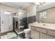 Bathroom featuring tiled walls, a glass-enclosed shower, and a vanity with a sink at 16500 Quarter Horse Ct, Montverde, FL 34756