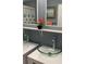 Bathroom with a double sink vanity, modern faucets, and a decorative shelf at 16500 Quarter Horse Ct, Montverde, FL 34756