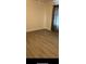 An empty bedroom featuring light brown flooring and neutral-colored walls at 16500 Quarter Horse Ct, Montverde, FL 34756