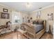 Charming bedroom featuring an ornate bed frame, hardwood floors, and whimsical decor at 16500 Quarter Horse Ct, Montverde, FL 34756