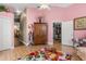 Cheerful bonus room with vaulted ceilings and walk-in closet with bright pink walls at 16500 Quarter Horse Ct, Montverde, FL 34756