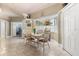 Dining area with natural light, a view of the backyard, and stylish décor at 16500 Quarter Horse Ct, Montverde, FL 34756