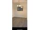 An empty dining room with hardwood floors and decorative light fixture at 16500 Quarter Horse Ct, Montverde, FL 34756