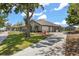 Sprawling home featuring a long driveway, two-car garage, and picturesque landscaping, exuding curb appeal at 16500 Quarter Horse Ct, Montverde, FL 34756