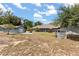 Expansive property featuring a detached garage, home and screened-in lanai offers ample space and possibilities at 16500 Quarter Horse Ct, Montverde, FL 34756