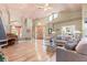 Inviting living room features a piano, a vaulted ceiling, and stylish furniture, creating a comfortable atmosphere at 16500 Quarter Horse Ct, Montverde, FL 34756