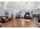 Open living room with hardwood floors and blue walls at 16500 Quarter Horse Ct, Montverde, FL 34756