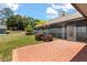 Outdoor patio featuring a screened-in lanai and brick paving perfect for outdoor relaxation and entertainment at 16500 Quarter Horse Ct, Montverde, FL 34756