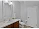 Cozy half bath featuring white countertops, vanity sink, and a decorative mirror at 1821 San Jacinto Cir, Sanford, FL 32771