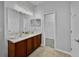 Bathroom featuring double sinks with vanity cabinets and a walk-in closet at 1821 San Jacinto Cir, Sanford, FL 32771