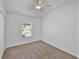 Cozy bedroom with plush carpet and a window at 1821 San Jacinto Cir, Sanford, FL 32771