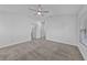Bright and airy bedroom featuring neutral carpets, and a modern ceiling fan at 1821 San Jacinto Cir, Sanford, FL 32771